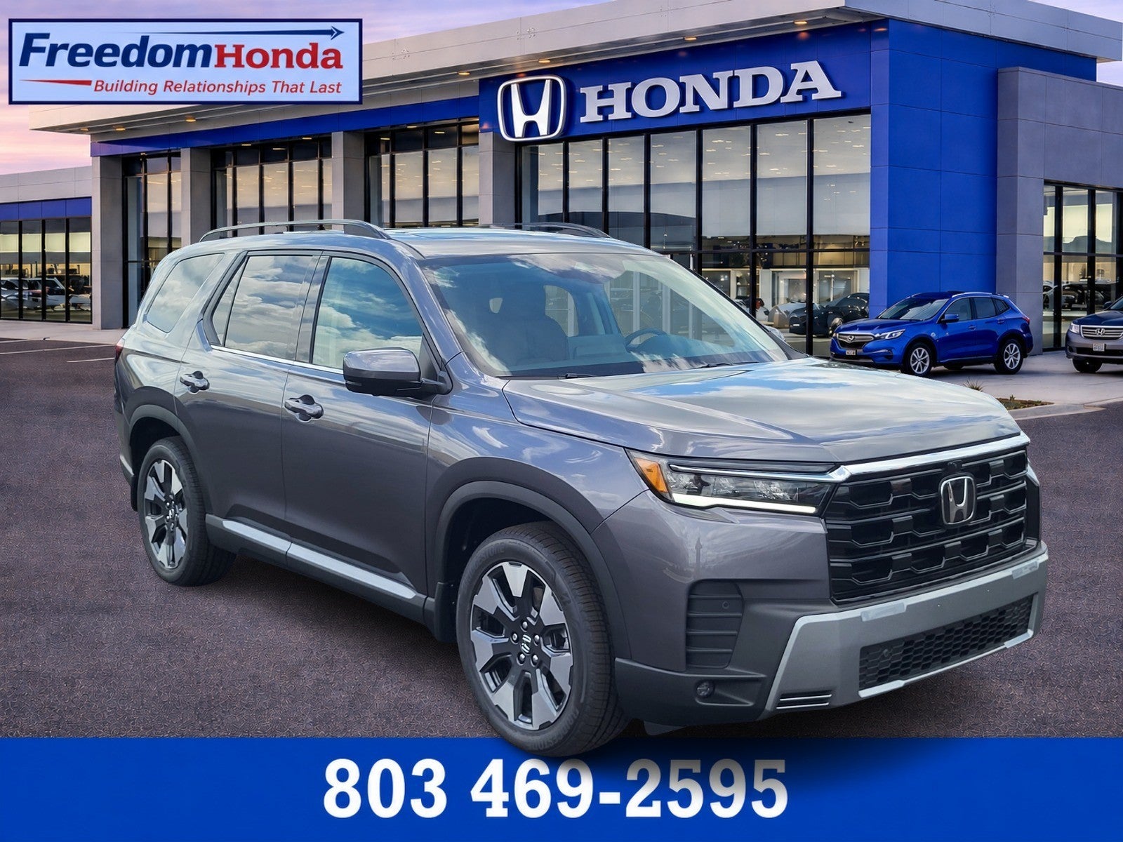 2026 Honda Pilot Touring in Modern Steel Metallic — front three-quarter view